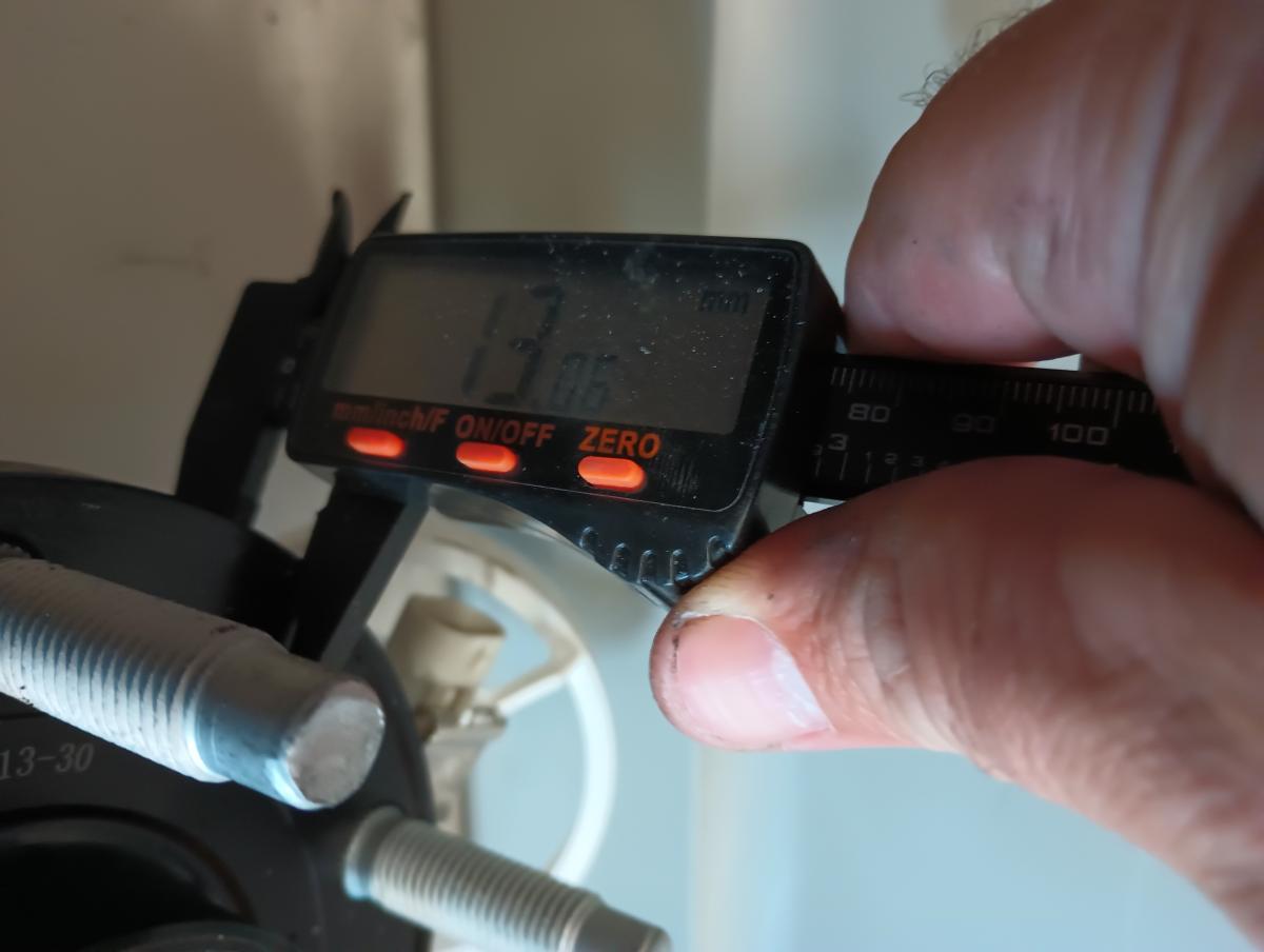 A caliper measurement of the C5 Corvette MPI Wheel Hub Face, which is 13mm in thickness.