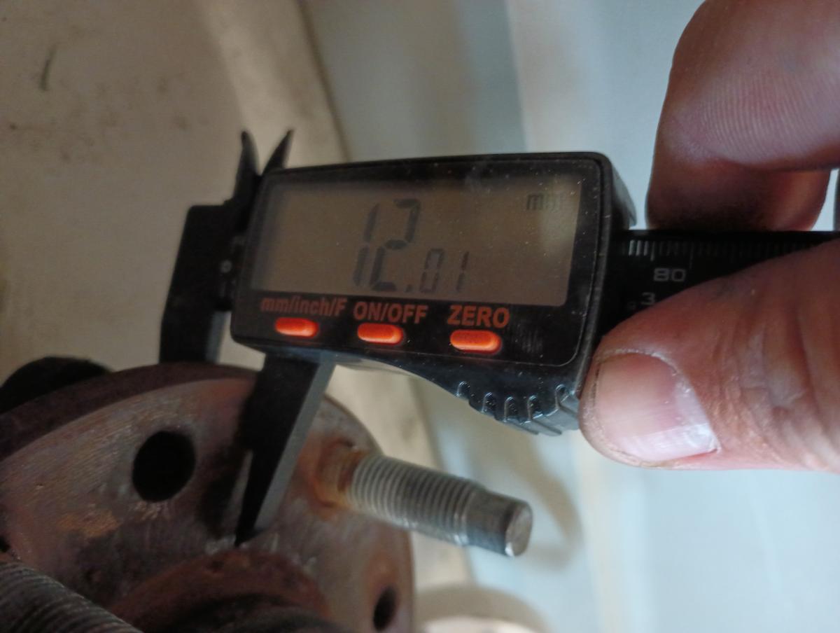 A caliper measurement of the C5 Corvette OEM wheel bearing, which reads 12.01mm