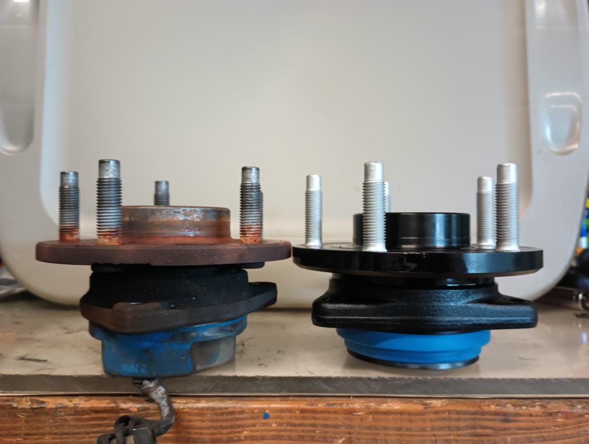 Side by side photo of an OEM C5 Corvette wheel hub assembly and an MPI Racing Wheel Hub Assembly.