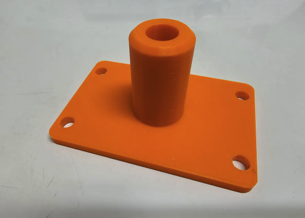 Ac centering jig for aligning the shifter on a C5 Corvette 3d printed in bright orange plastic.