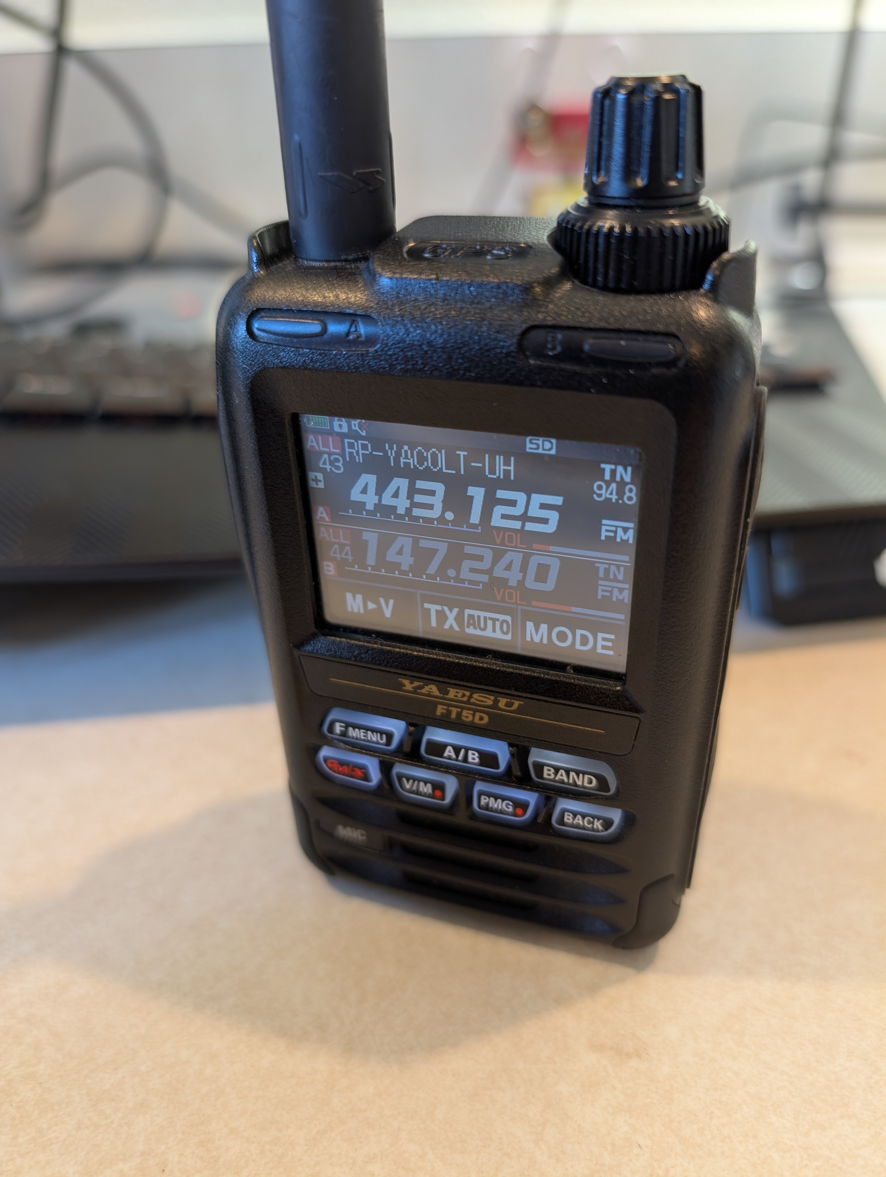 A Yaesu FT-5DR handheld HAM radio showing some frequencies and channel information