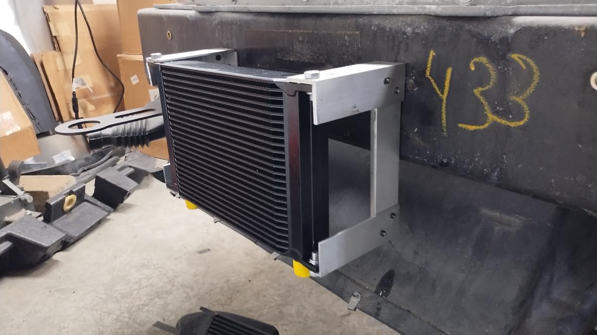 A 25 row oil cooler installed with a custom angle aluminum bracket on a 1999 C5 Corvette