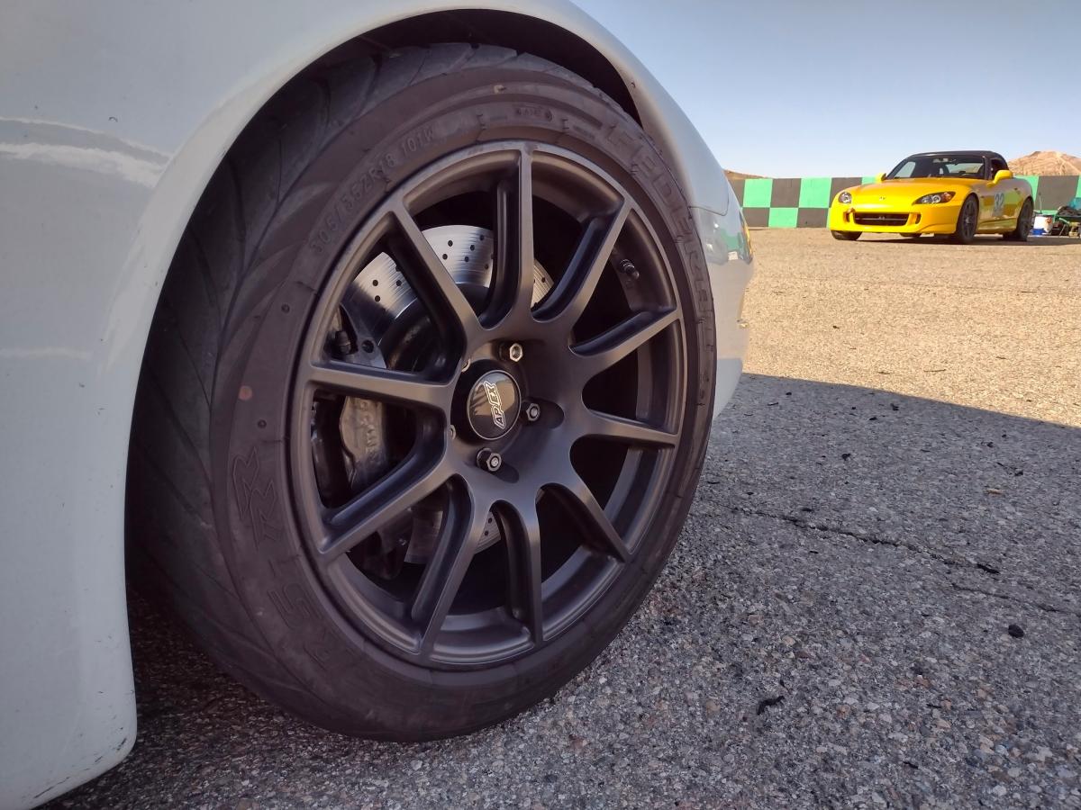 Front passenger side wheel of a c5 Corvette with Apex SM10 ET 57 wheels and the Cadillac Brembo brakes underneath them.