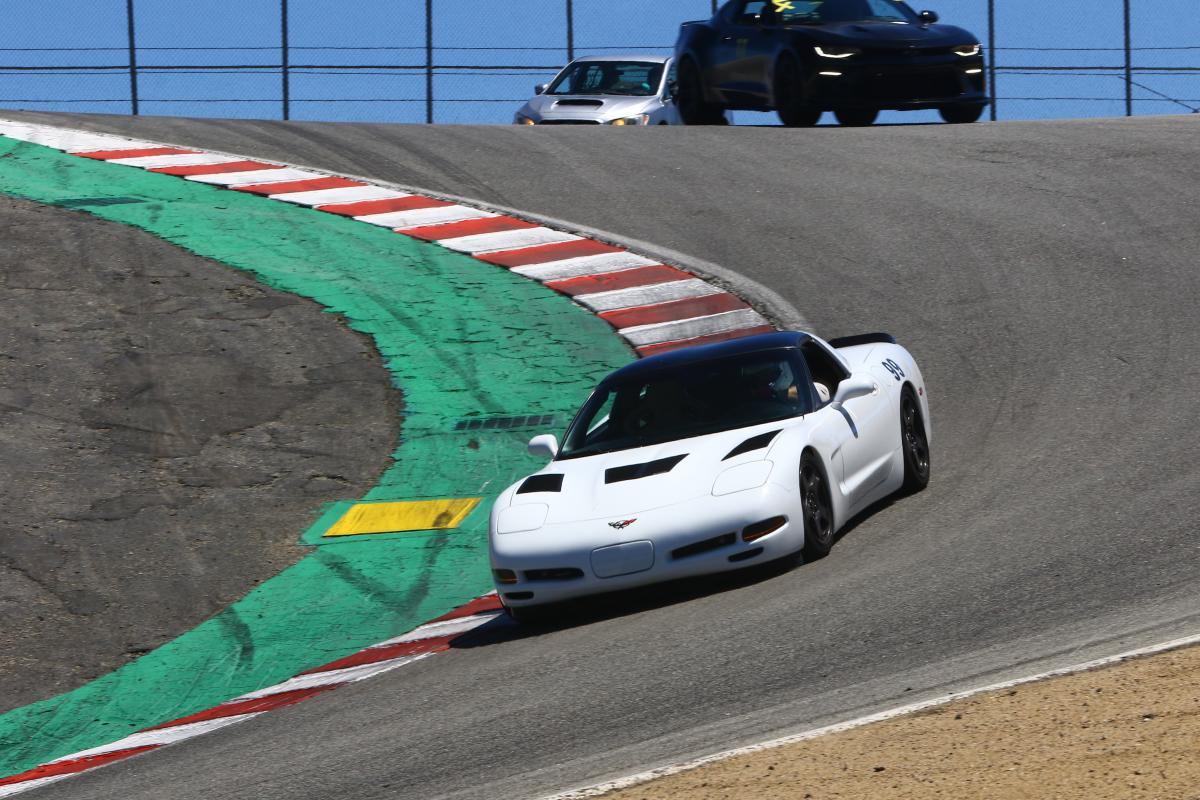 Jesse in the 99 Corvette navigating the Laguna Seca Corkscrew