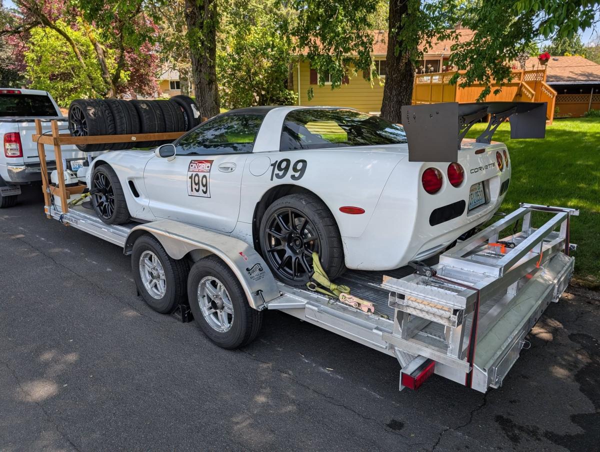 Shred Jesse's White C5 Corvette with full aero on his aluminum open trailer, with new aluminum ramps strapped to the back
