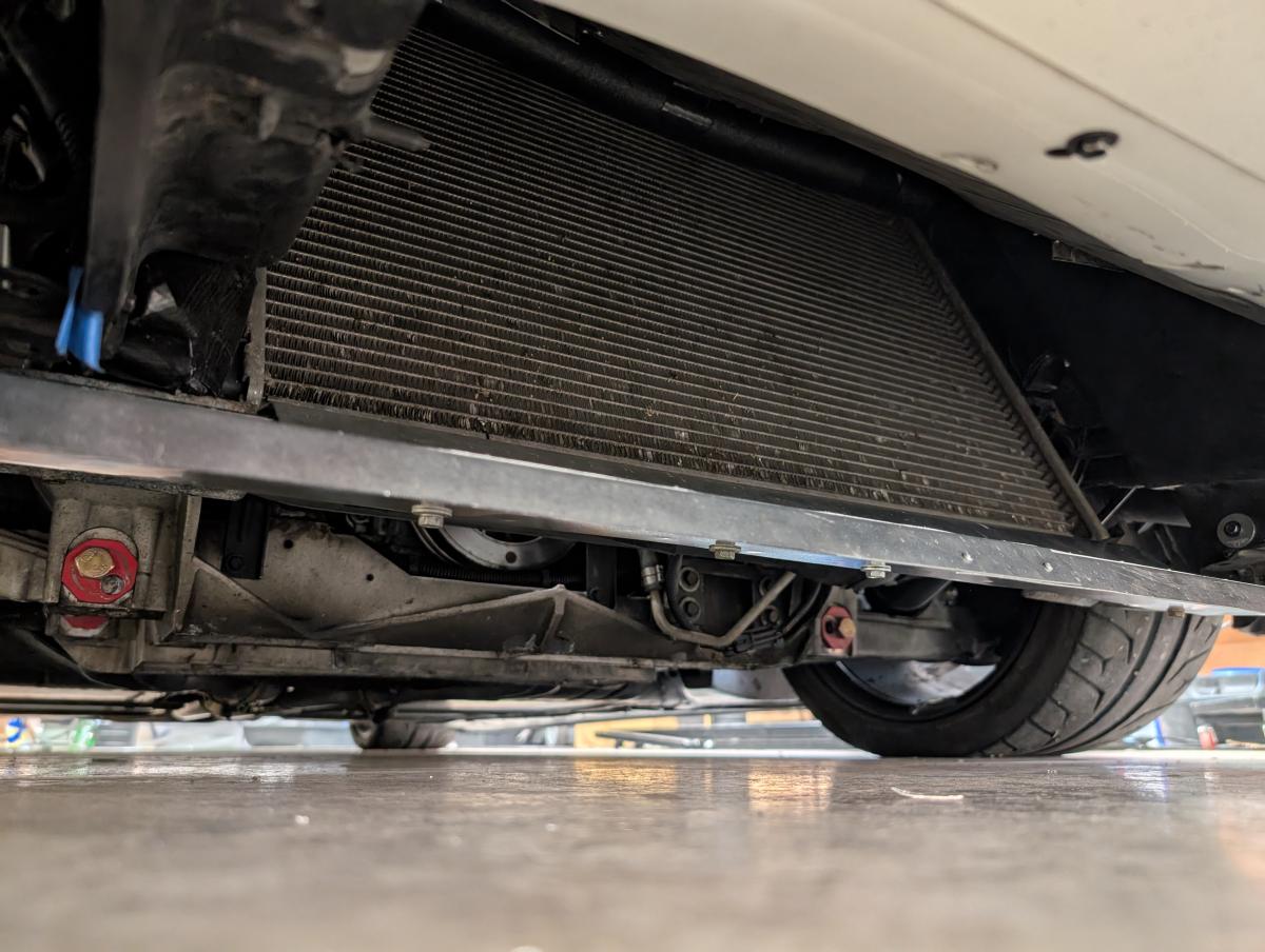 Bottom view of a standard leaning c5 Corvette radiator, with a custom aluminum air diverter to get air up to the radiator.