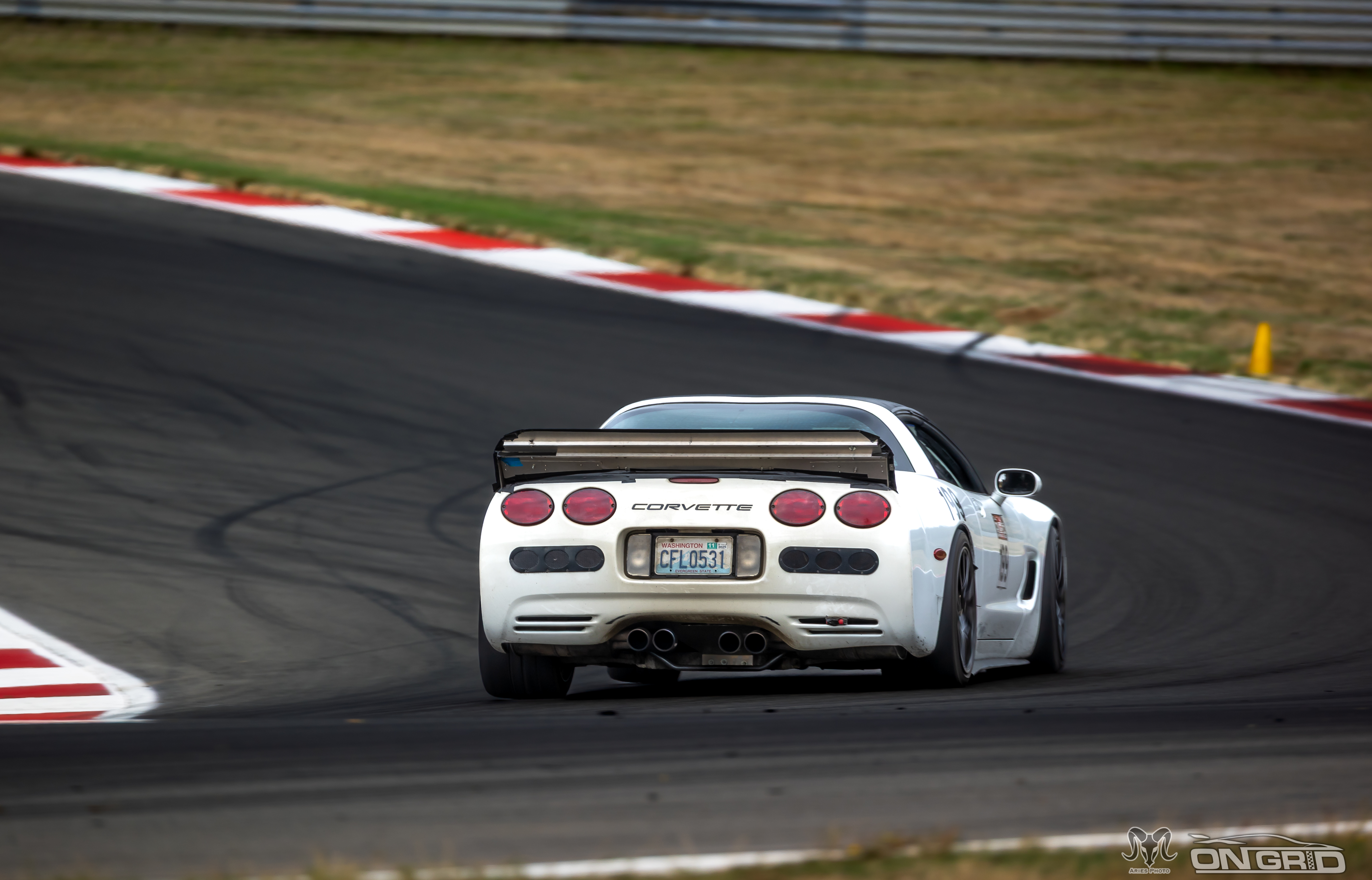 Rear view of white #199 C5 Corette at the ridge.
