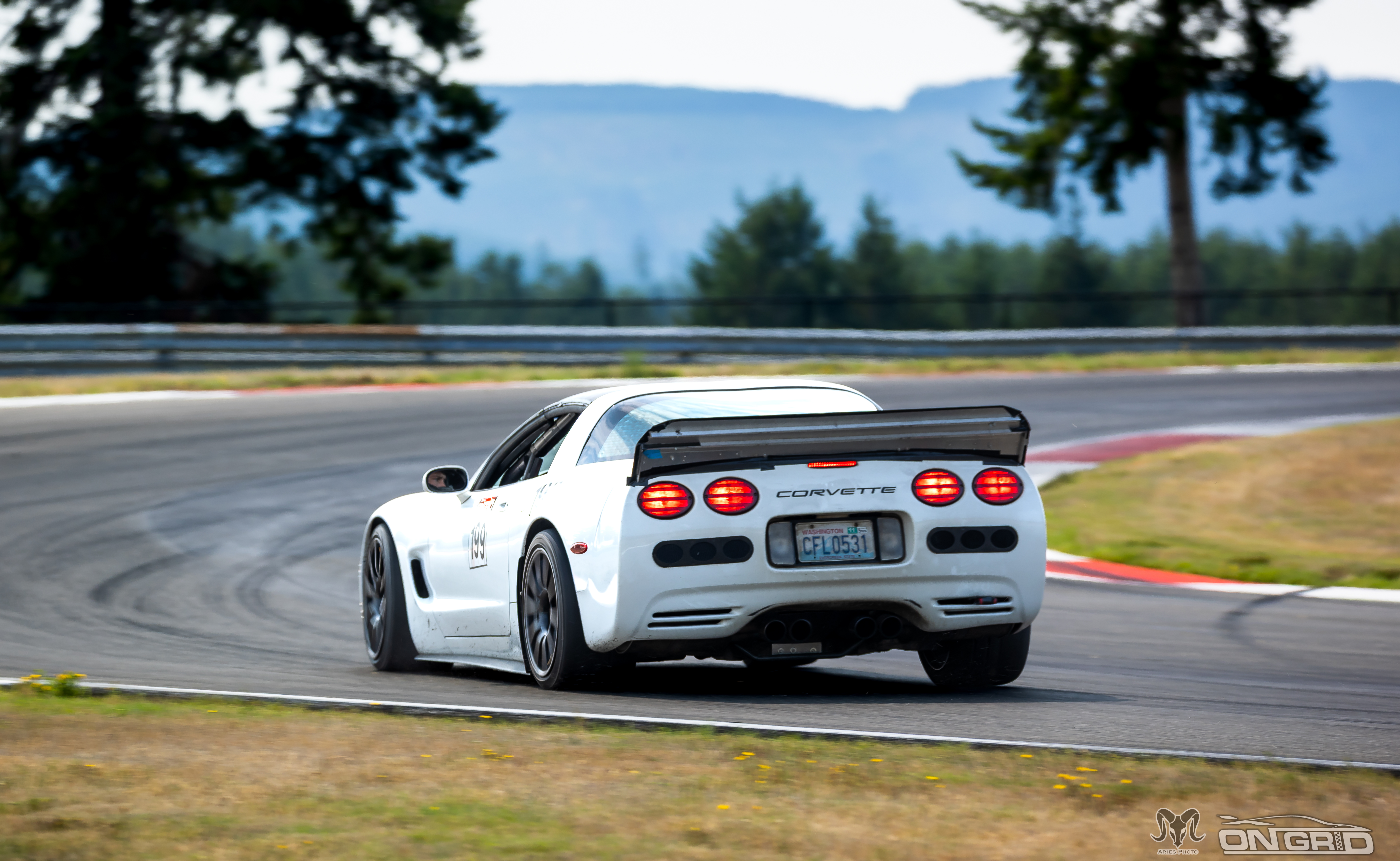 Rear shot of a white C5 Corvette at the ridge
