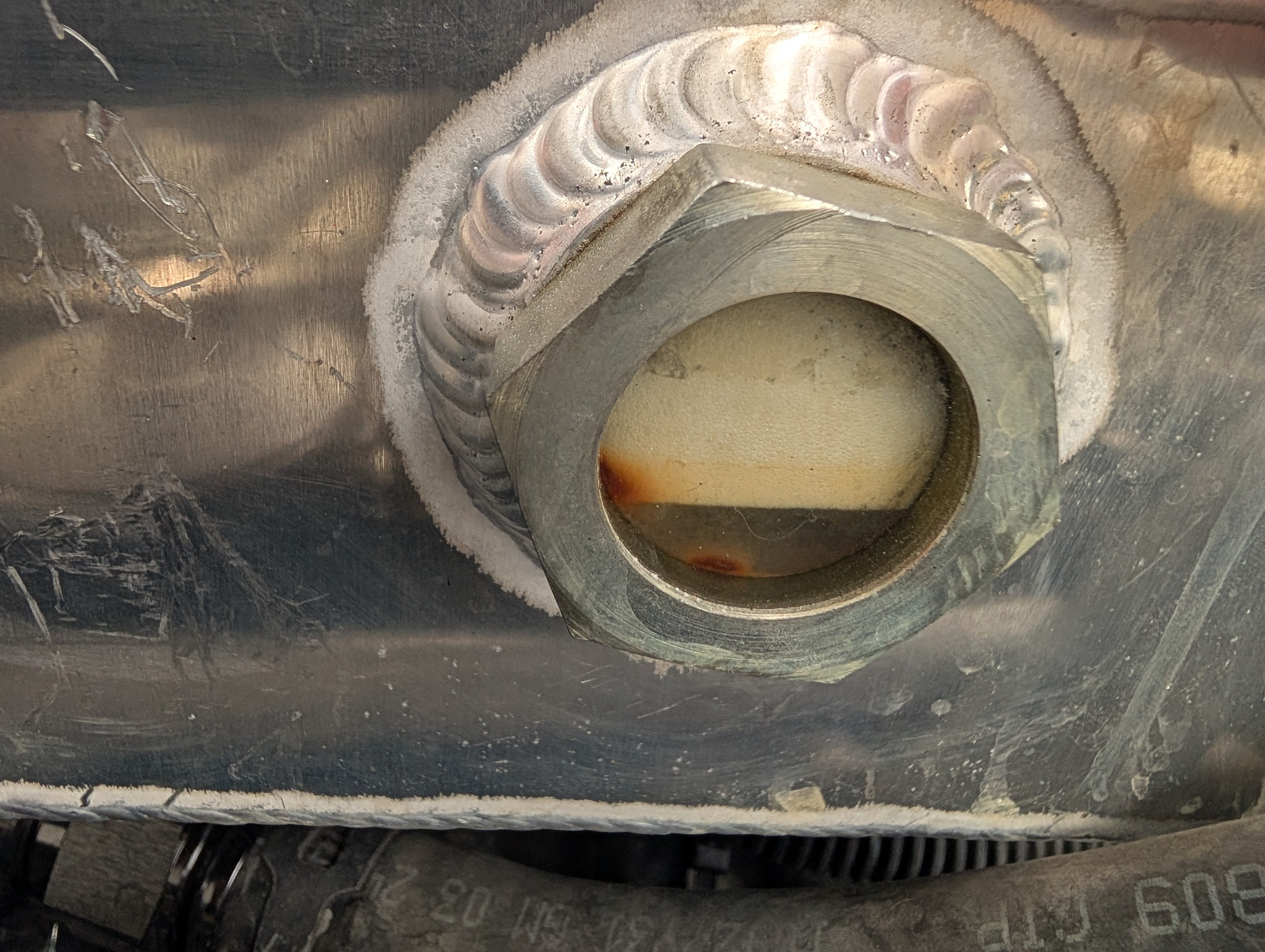 Frothy coolant as visible through the sight port on Shred Jesse's C5 Corvette coolant expansion tank