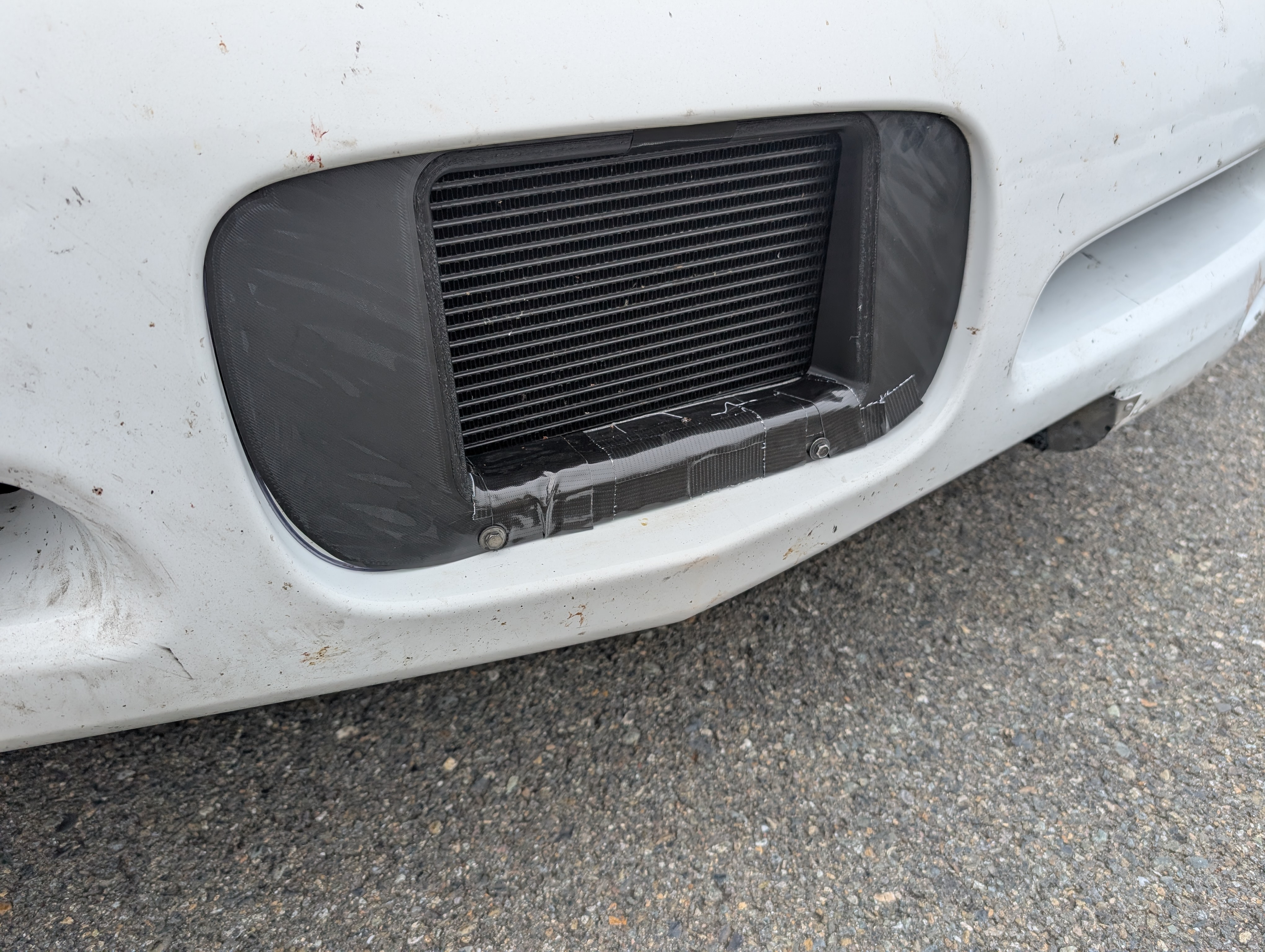 The front oil cooler duct jesse 3d printed, this time gorilla taped up to hold it together since it didn't hold!