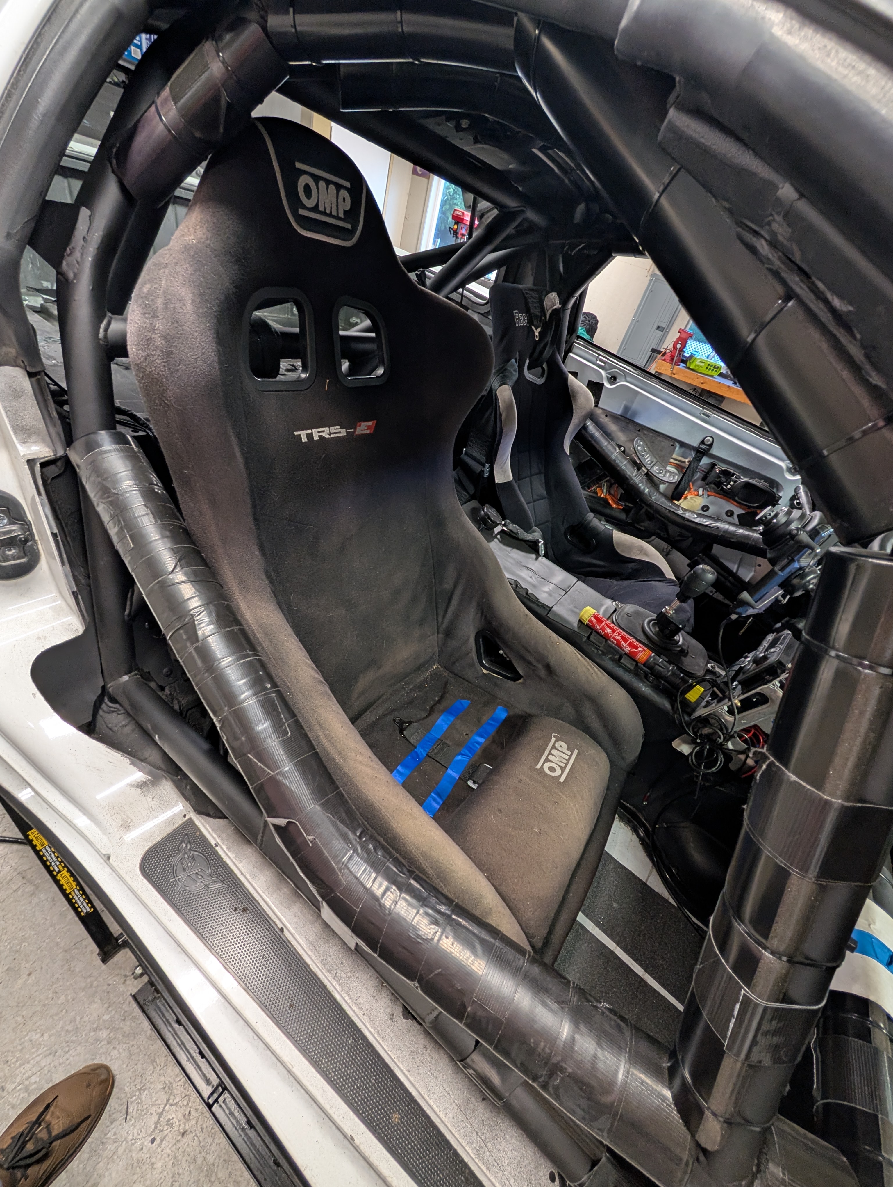 An OMP seat mounted in the passenger side of Shred Jesse's C5 Corvette.