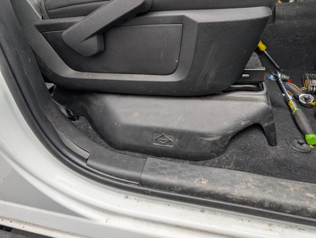 A picture of the passenger seat on a Ram 3500, which has an ICOM-5100 mounted below it where you can't even see it. A very stealth installation.