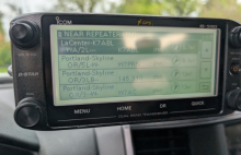 A powered up ICOM-5100 head unit showing nearby repeater search functionality