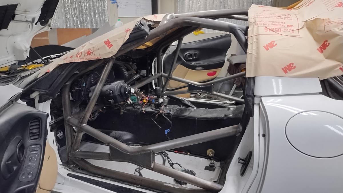 Side view of the front half of the completely welded in Trackspec C5 Corvette rollcage