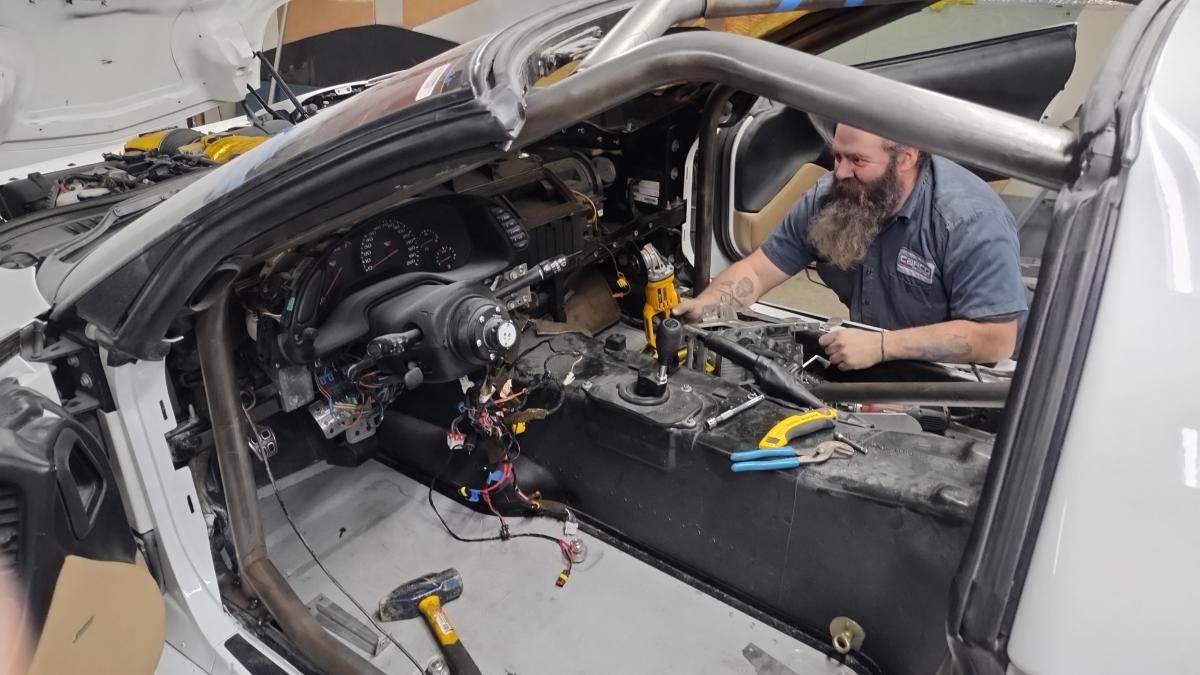 Dave aka Groundscore stopping to analyze the initial fitment of the initial mock in of the Trackspec C5 Corvette roll cage front half