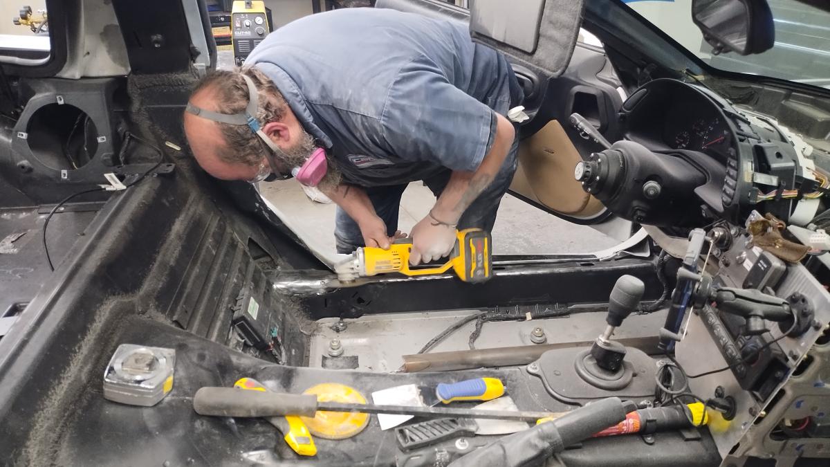 Dave aka Groundscore making the initial cuts for being able to drop the main hoop down on the C5 Corvette Trackspec Rollcage install