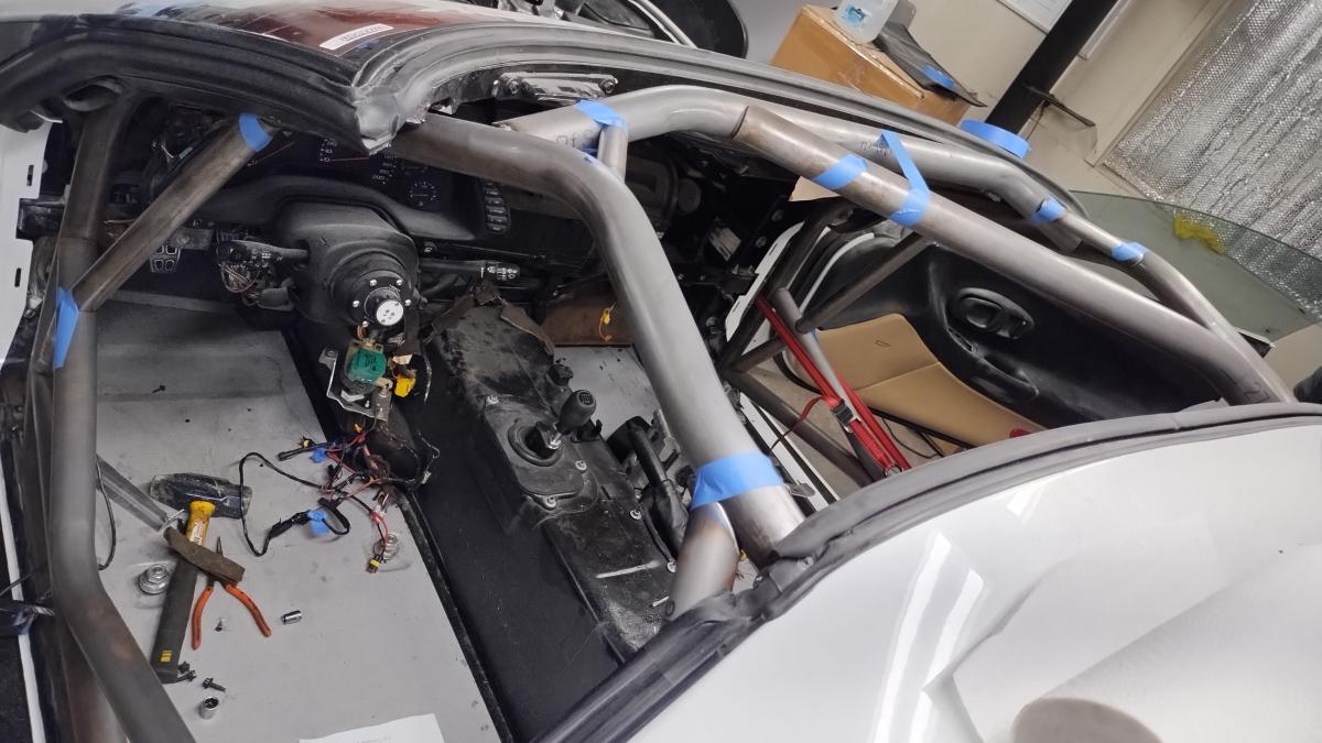 An overhead look of a tacked and taped together front half of a Trackspec C5 Corvette Roll Cage in the car itself.