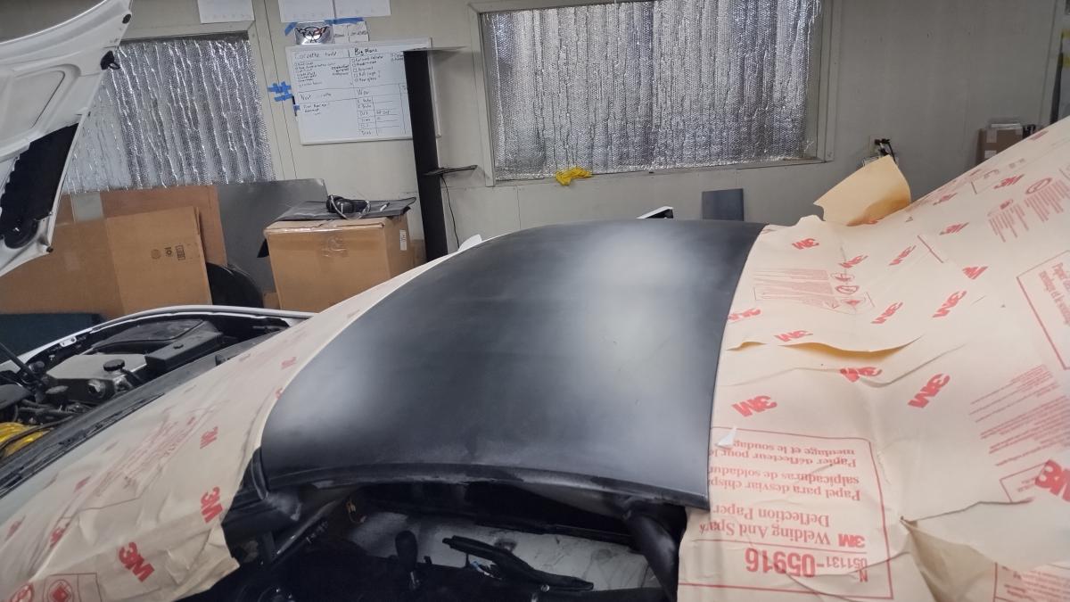 The OEM glass (but painted) Targa top on the C5 Corvette, demonstrating how it can fit and clears the trackspec rollcage