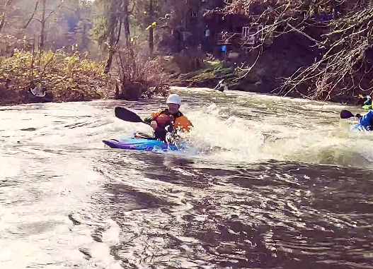 Jesse mid rapid surfing the Antix 3